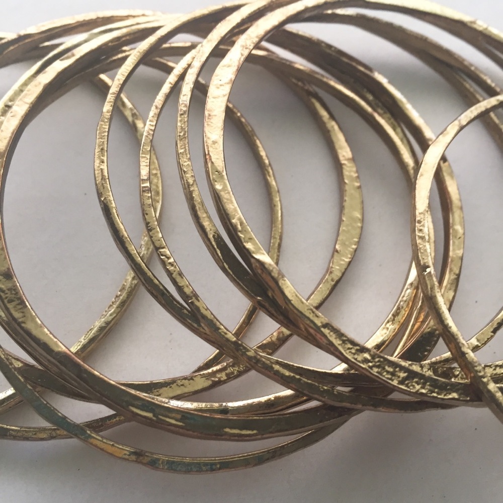 Set 12 gold tone hammered look bangle bracelets